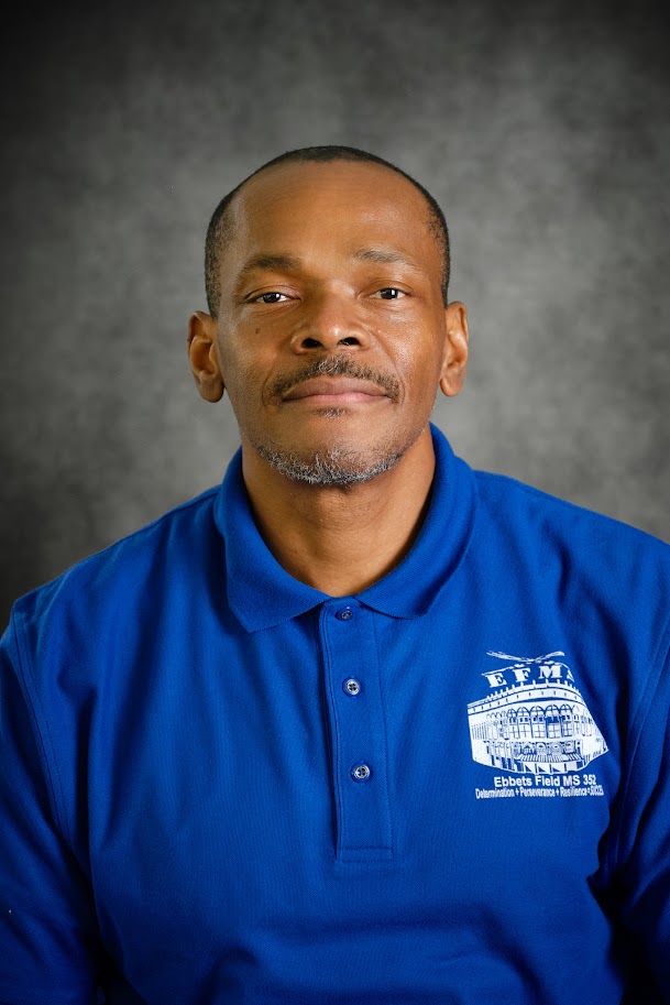 Staff member in blue school polo shirt
