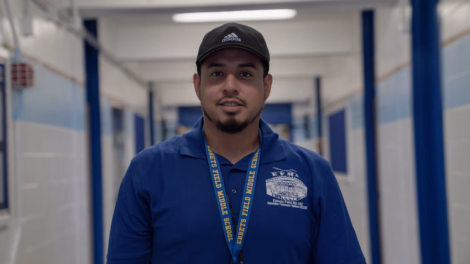 Staff member Jonathan Neira in school hallway
