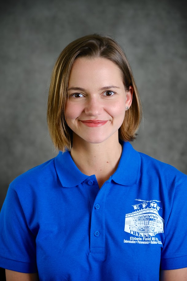 Student wearing blue school polo shirt