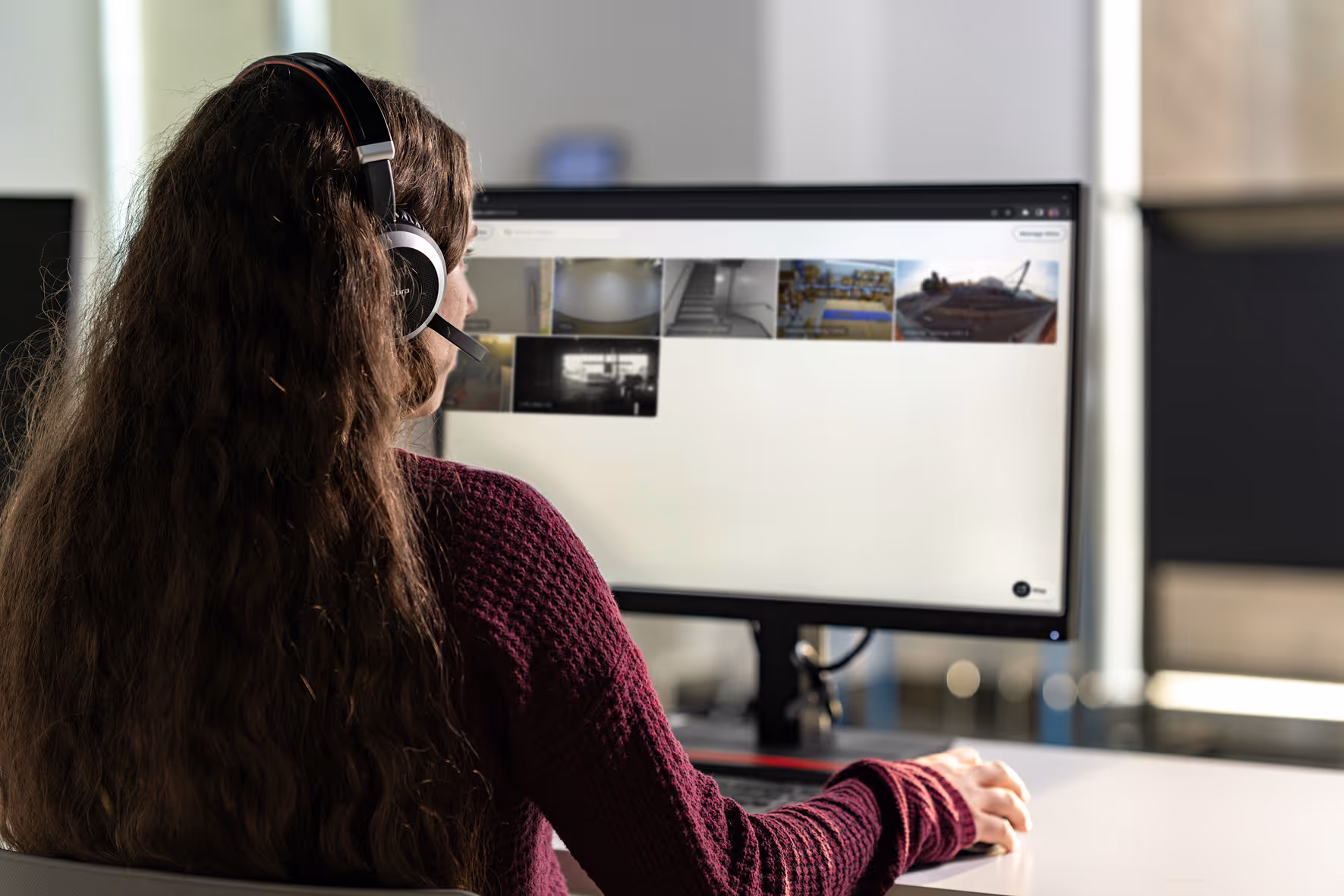 person monitoring security cameras