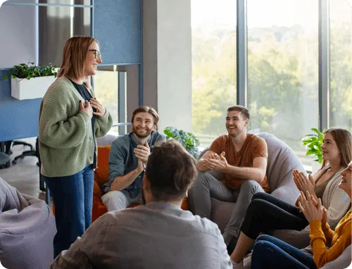 A group of people chatting and laughing 