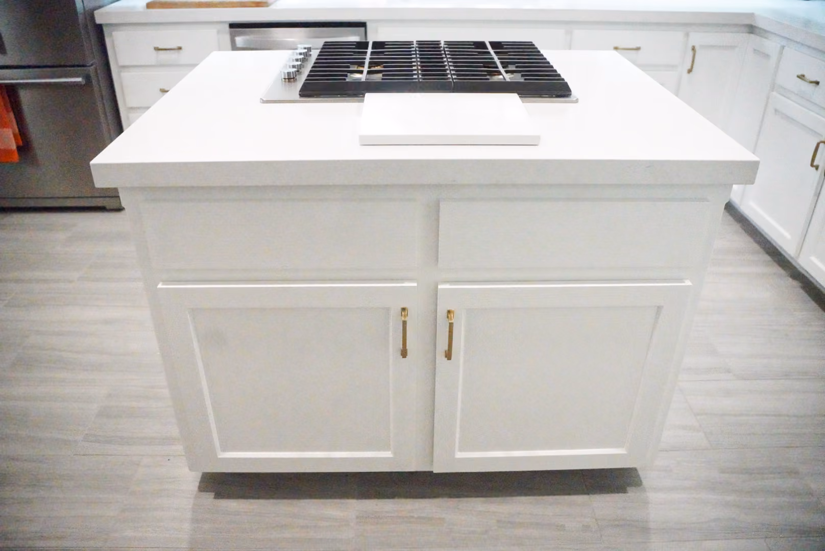 Kitchen remodel in Modesto by kitchen & bath CRATE – kitchen island, cabinets, countertops, quartz, appliances, flooring, vinyl plank, hardware