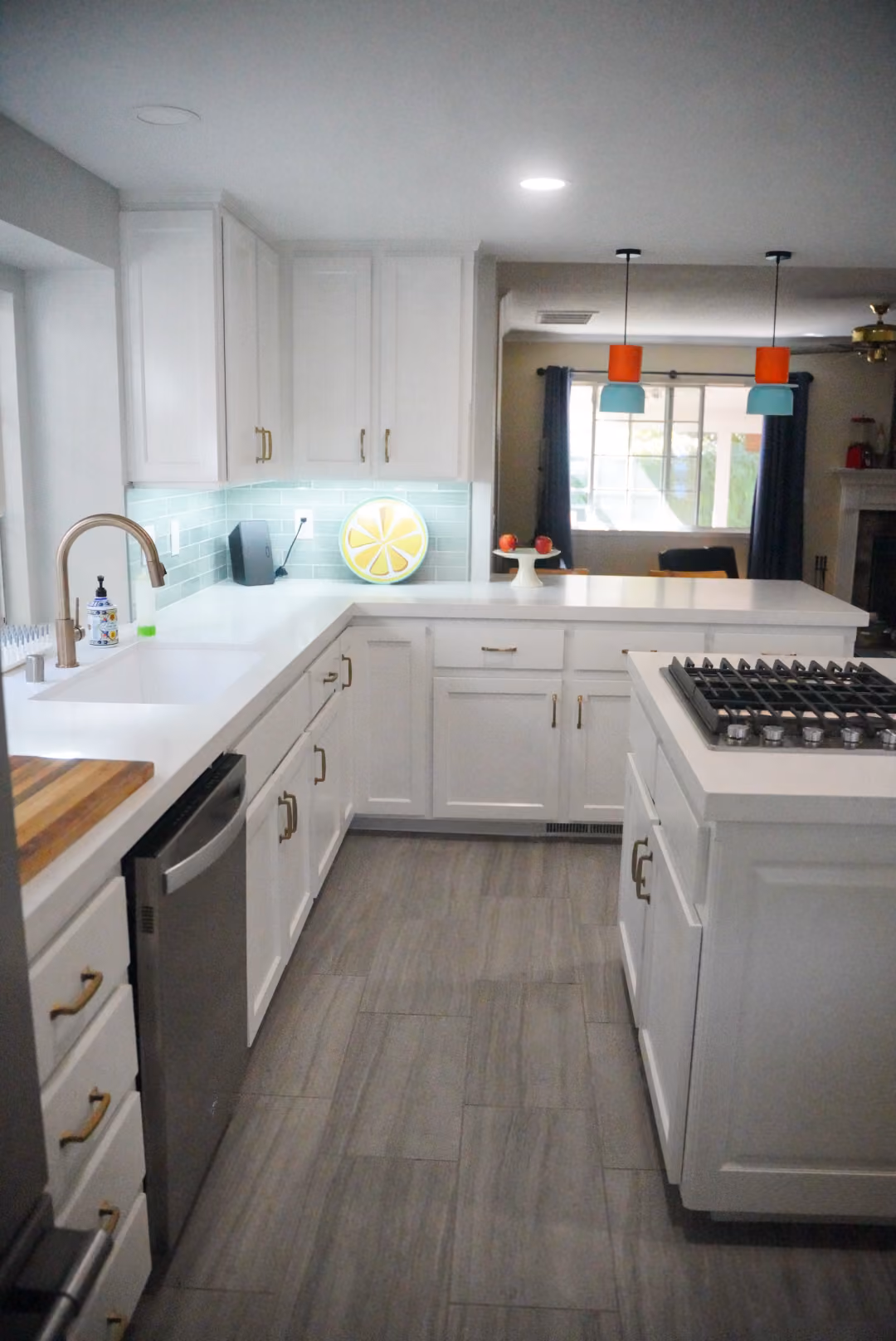 Kitchen remodel in Modesto by kitchen & bath CRATE – cabinets, kitchen island, countertops, backsplash, lighting, appliances, flooring, vinyl plank
