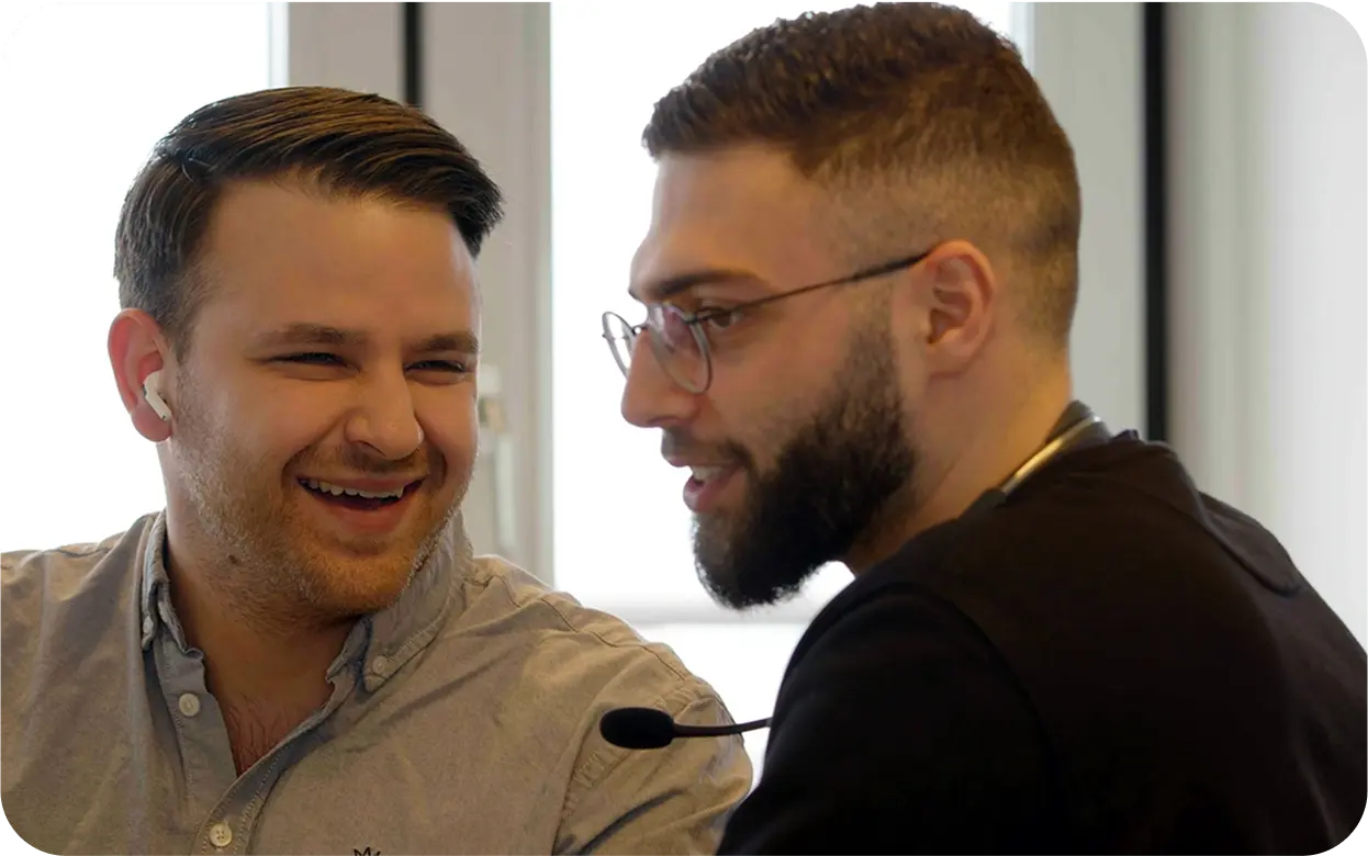 A couple of men standing next to each other.
