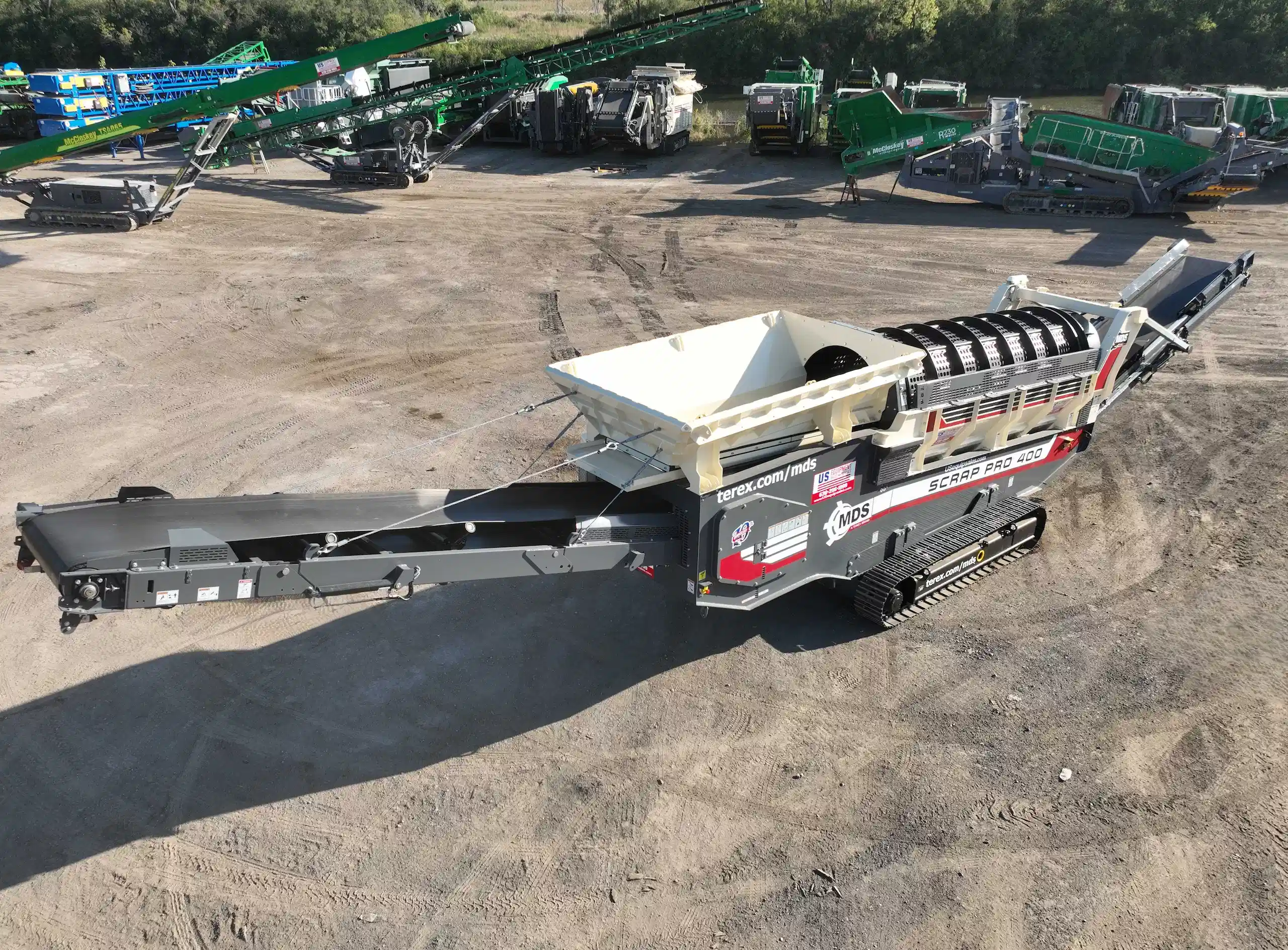 MDS Scrap Pro 400 tracked trommel with feed hopper and discharge conveyor positioned in an equipment yard.