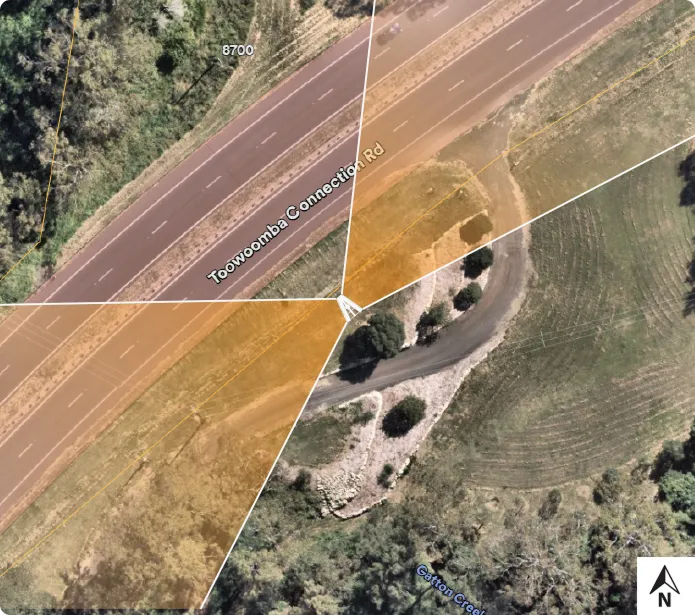 Aerial view of Toowoomba Connection Rd intersection and nearby access road/creek.