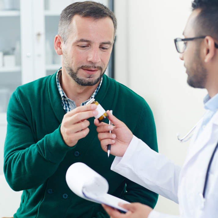 A doctor checking a patient's blood with a stethoscope.