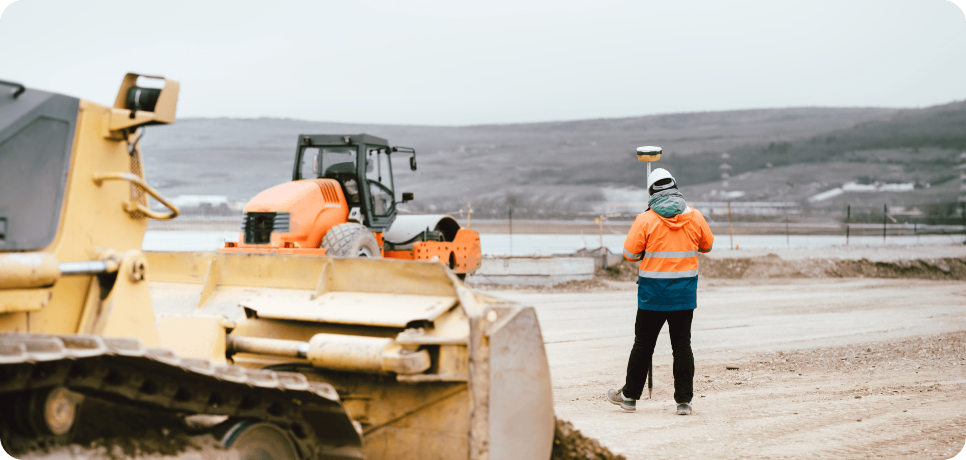 Mining workers wearing safety gear and helmets working at a mining site