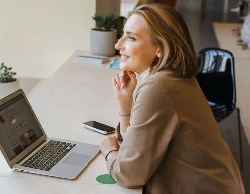 Woman sitting at computer.