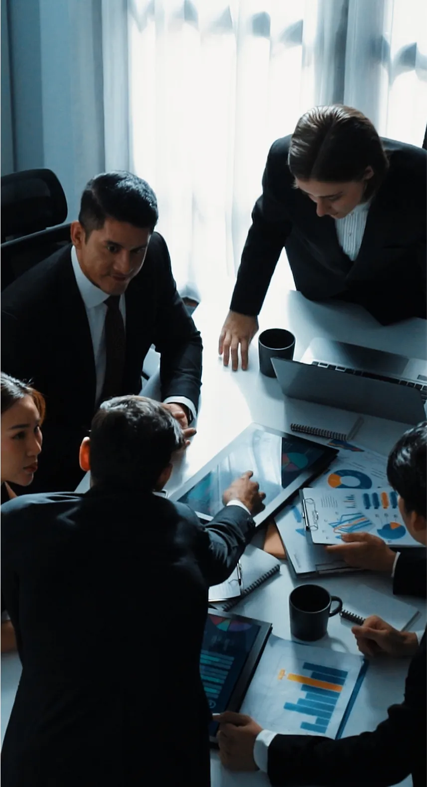 Gallagher Industries leadership team in a boardroom discussion