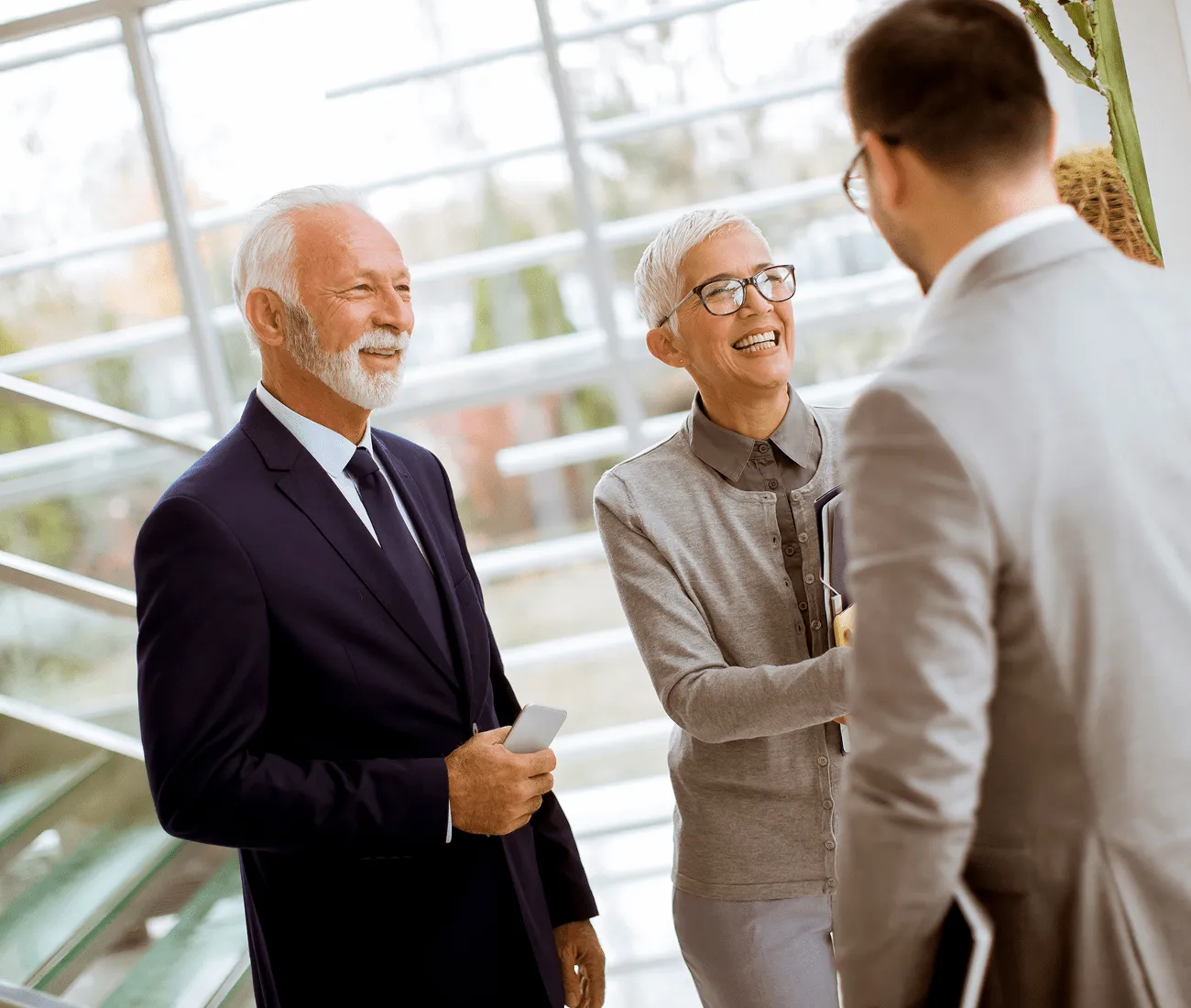 Gallagher Industries executives greeting partners with handshake