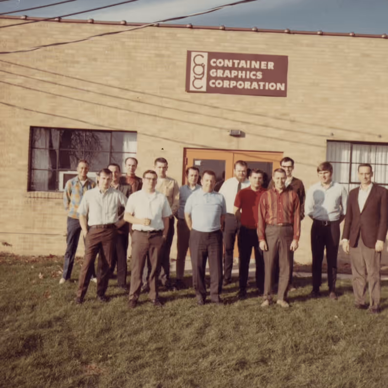 Early photo of Container Graphics's sales and leadership team in the 1960s