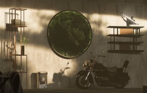 Vintage motorcycle parked indoors against a concrete wall with a circular moss decoration and minimalist shelves.
