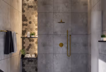 Modern shower area with gray concrete tiles, gold fixtures, hexagonal tile accent wall, and shelves holding toiletries and plants.