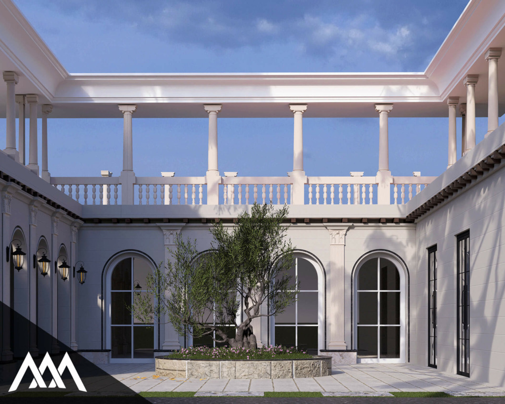 Courtyard with white columns, arched windows, and a central planter with an olive tree and flowers under a clear blue sky.