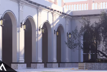 Sunlit courtyard with classical white columns and arched doorways.