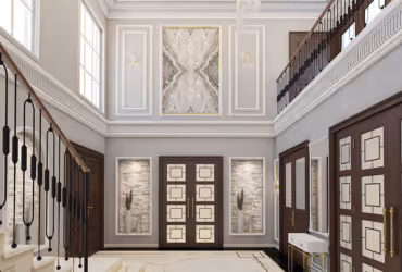 Elegant foyer with marble flooring, wooden double doors, modern art panels, and a staircase with black balusters.