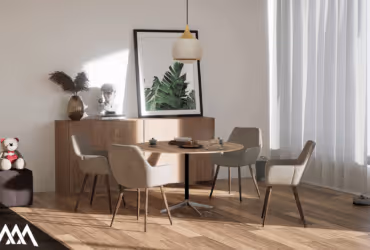 Bright dining area with round table, four beige chairs, wooden sideboard, framed botanical print, and large window with curtains.