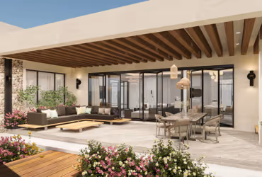 Modern outdoor patio with wooden pergola, sectional sofa, coffee table, dining table, and glass sliding doors.