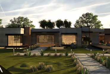 Modern single-story house with large windows and a landscaped front yard at sunset.