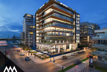 Modern multi-story building with large glass windows and a rooftop garden at dusk, surrounded by streets and nearby buildings.