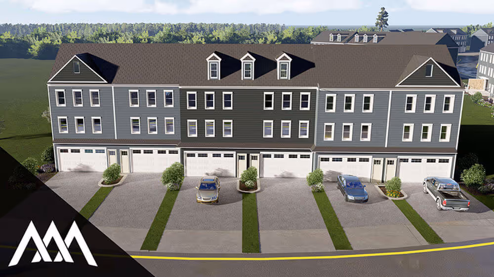 Three-story townhouse complex with attached garages and cars parked in front, surrounded by greenery.