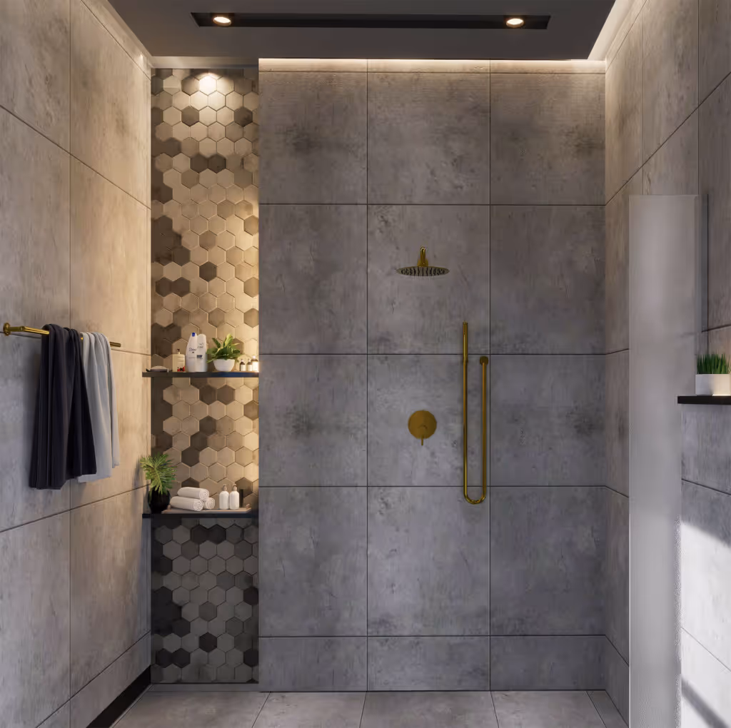 Modern shower area with large gray tiles, gold shower fixtures, hexagonal patterned wall niches with toiletries and plants, and towels hanging on a gold rod.