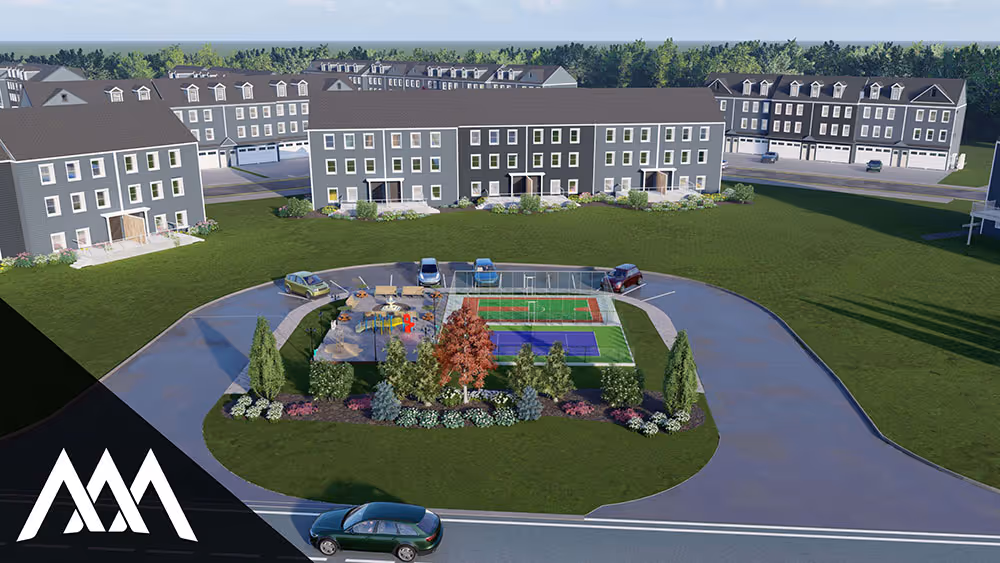 Aerial view of a residential area with three-story townhouses surrounding a central green space featuring a playground and tennis courts, with cars parked nearby.