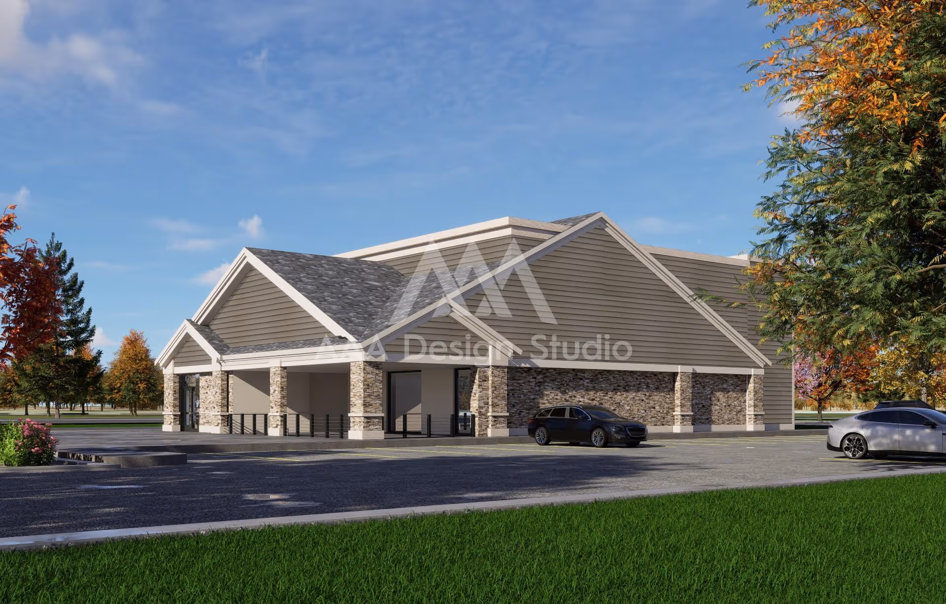 Modern commercial building with stone and siding exterior, surrounded by autumn trees and parked cars.