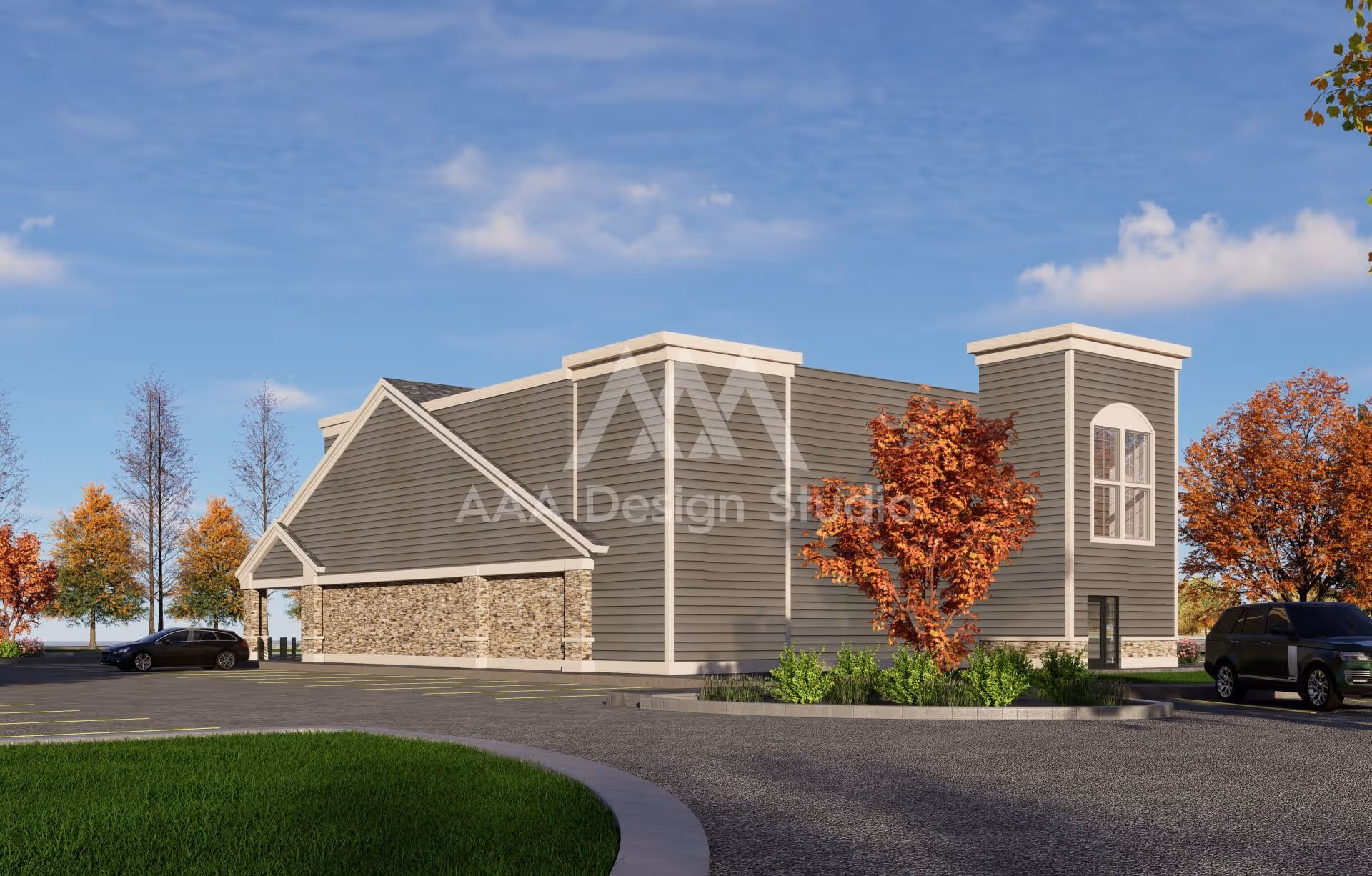Modern one-story building with gray siding and stone accents surrounded by autumn trees in a parking lot.