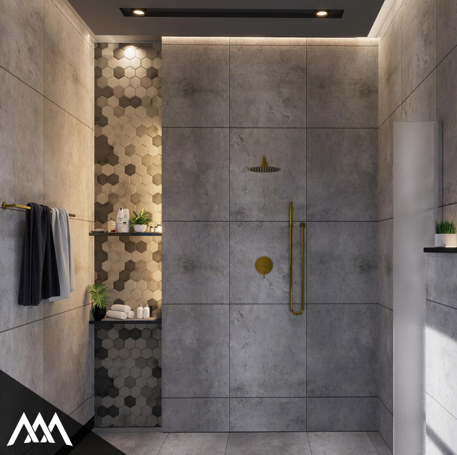 Modern shower area with large gray tiles, gold fixtures, hexagonal patterned shelf with toiletries, and two towels hanging on a gold towel rack.