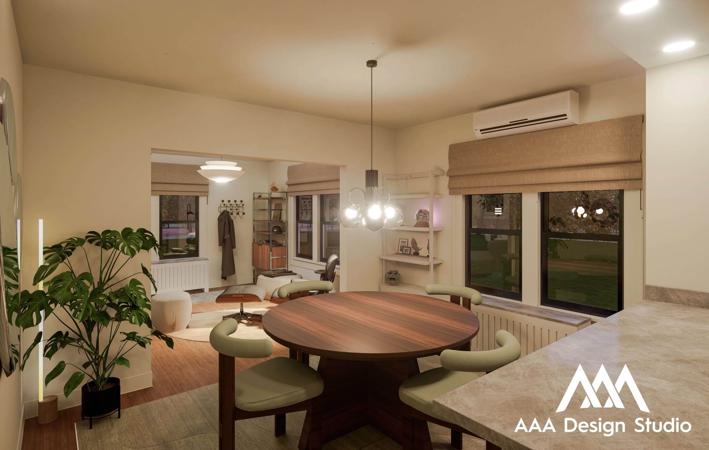Modern dining area with round wooden table, green cushioned chairs, pendant light, and view into cozy living room with lounge chair and plant.