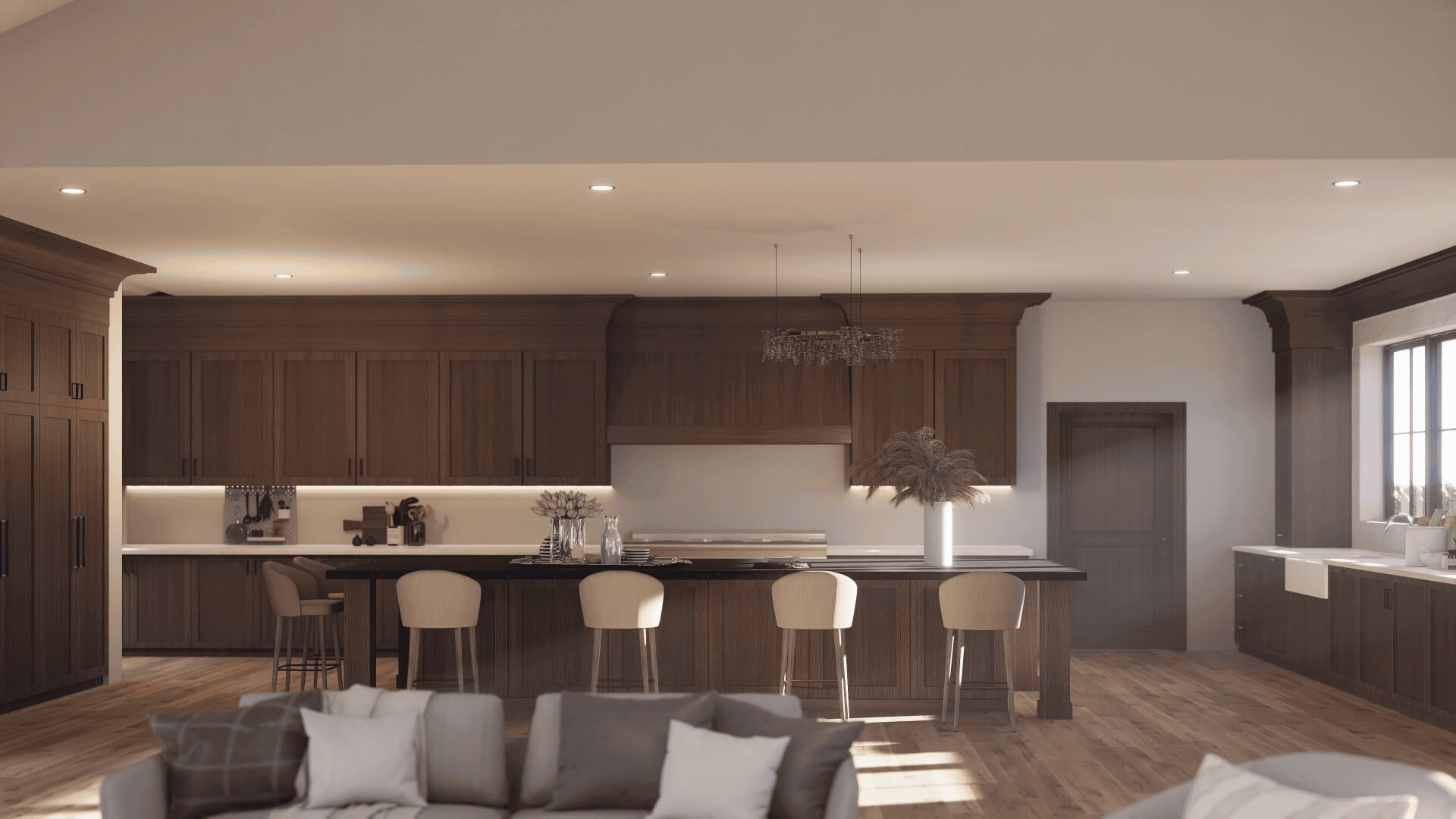 Modern dining area with round wooden table, green cushioned chairs, pendant light, and view into cozy living room with lounge chair and plant.