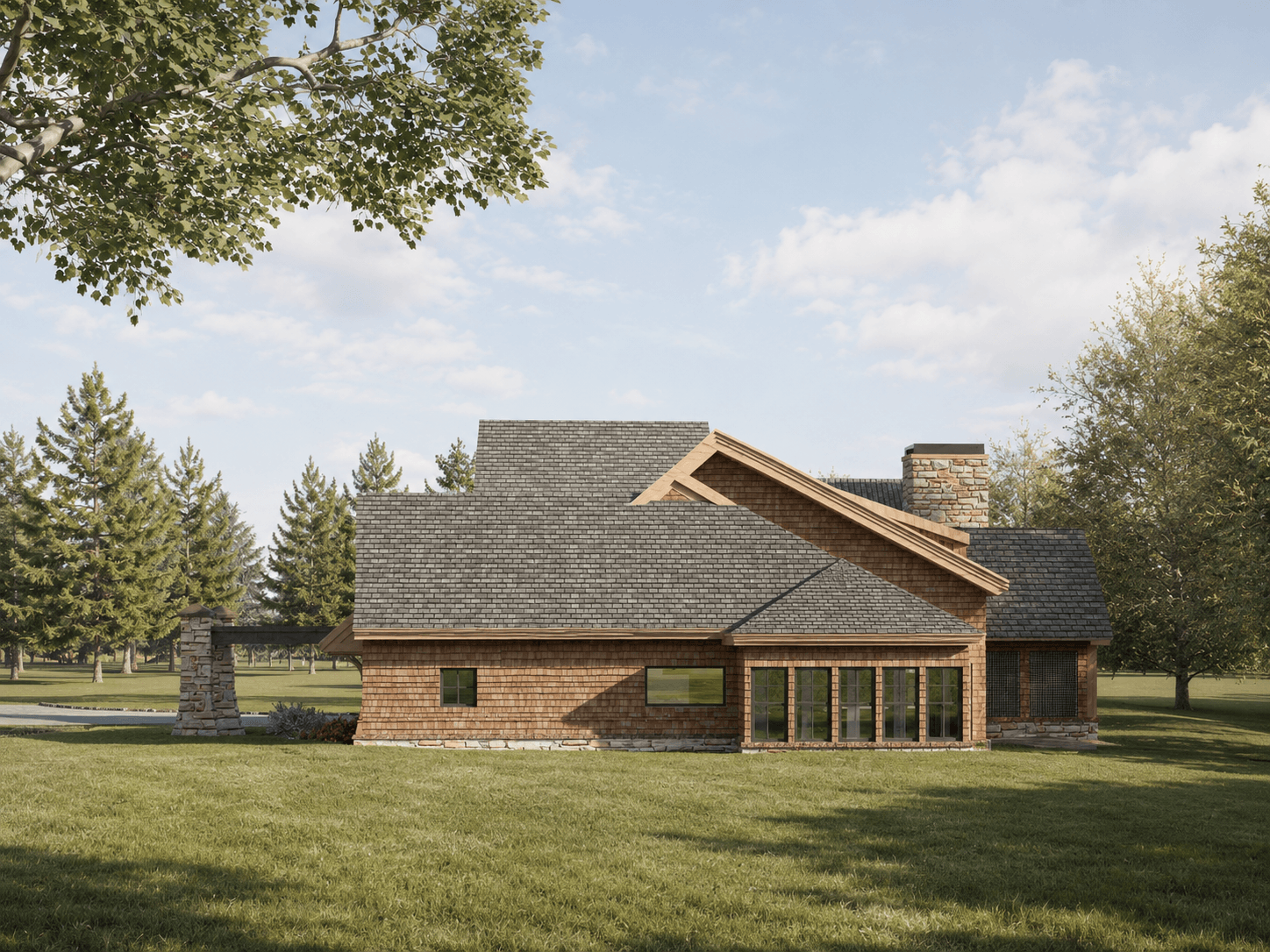 Side view of a single-story wooden house with large windows and a stone chimney surrounded by grass and trees.