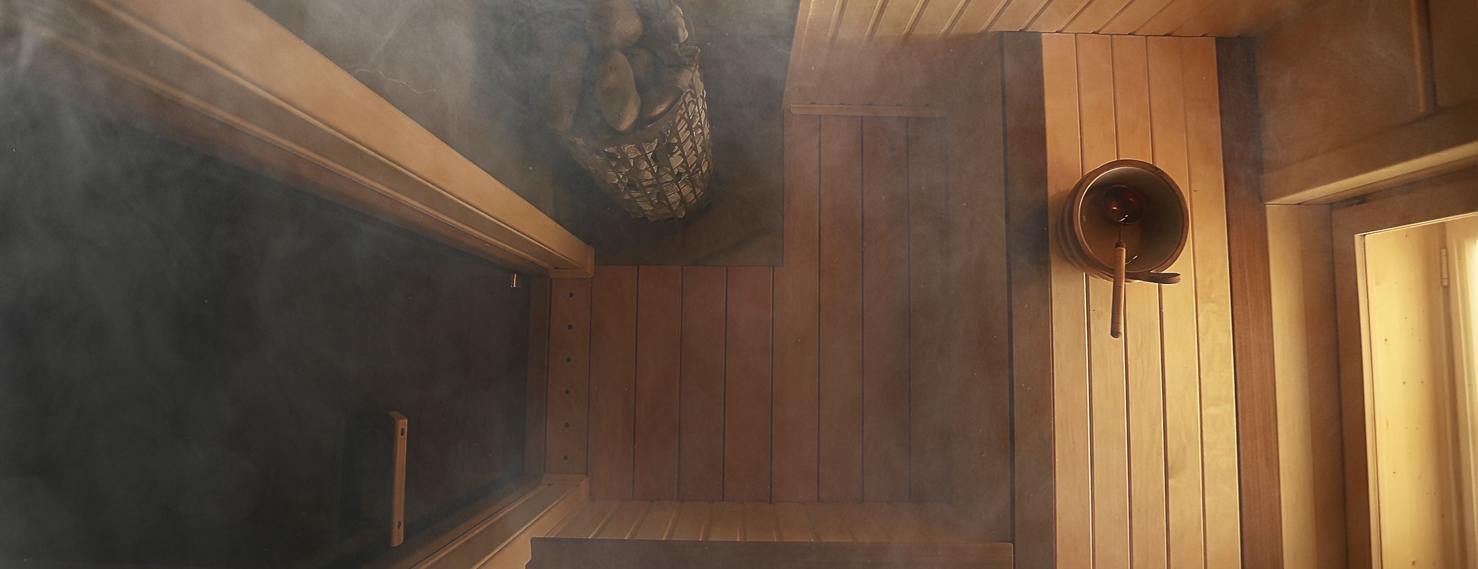 Warm interior of an alpine chalet with a burning fireplace and wooden decoration at the Refuge Chez La Tante, Megève