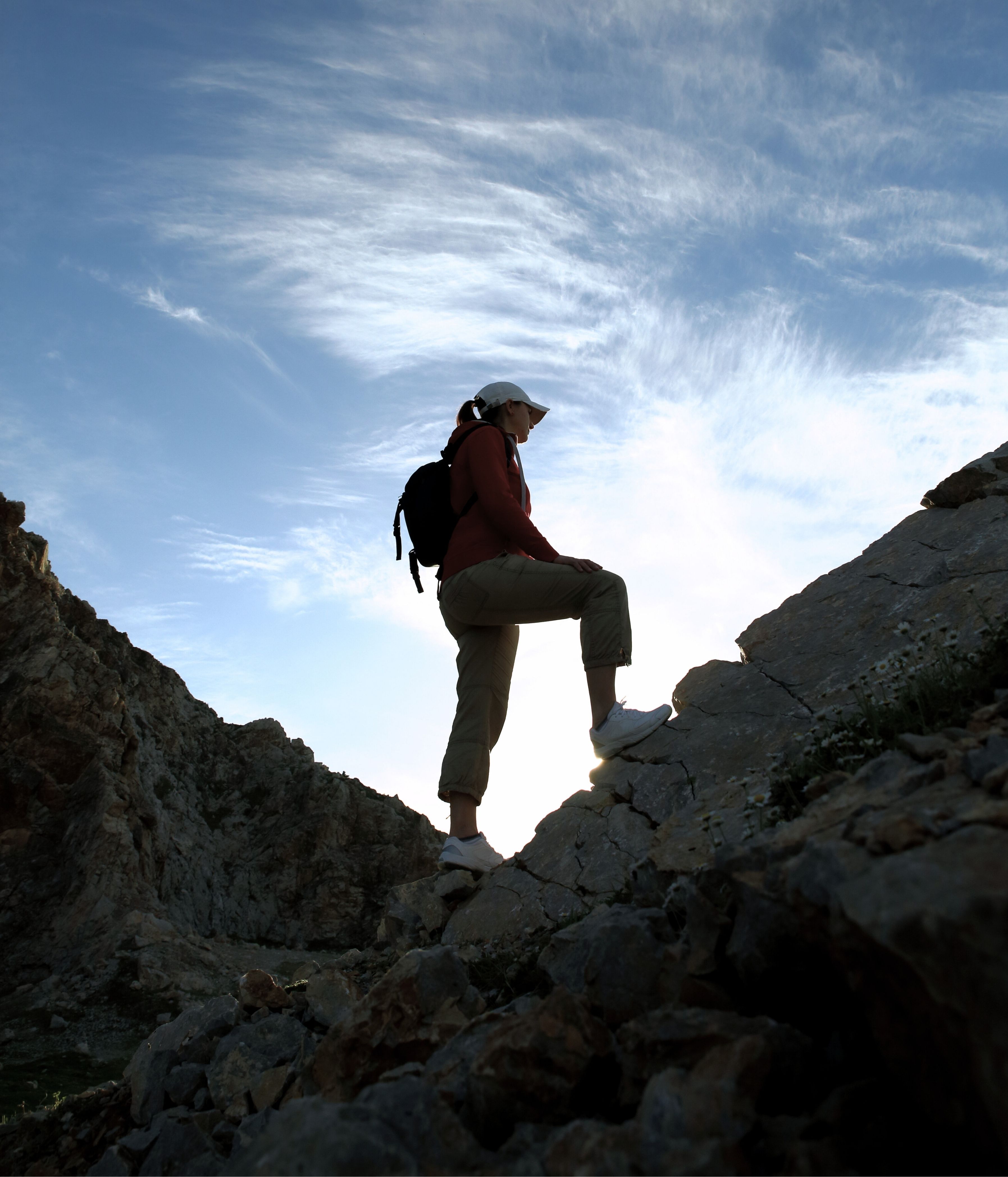 Hiker admiring the view of the mountains at sunset in Megève.