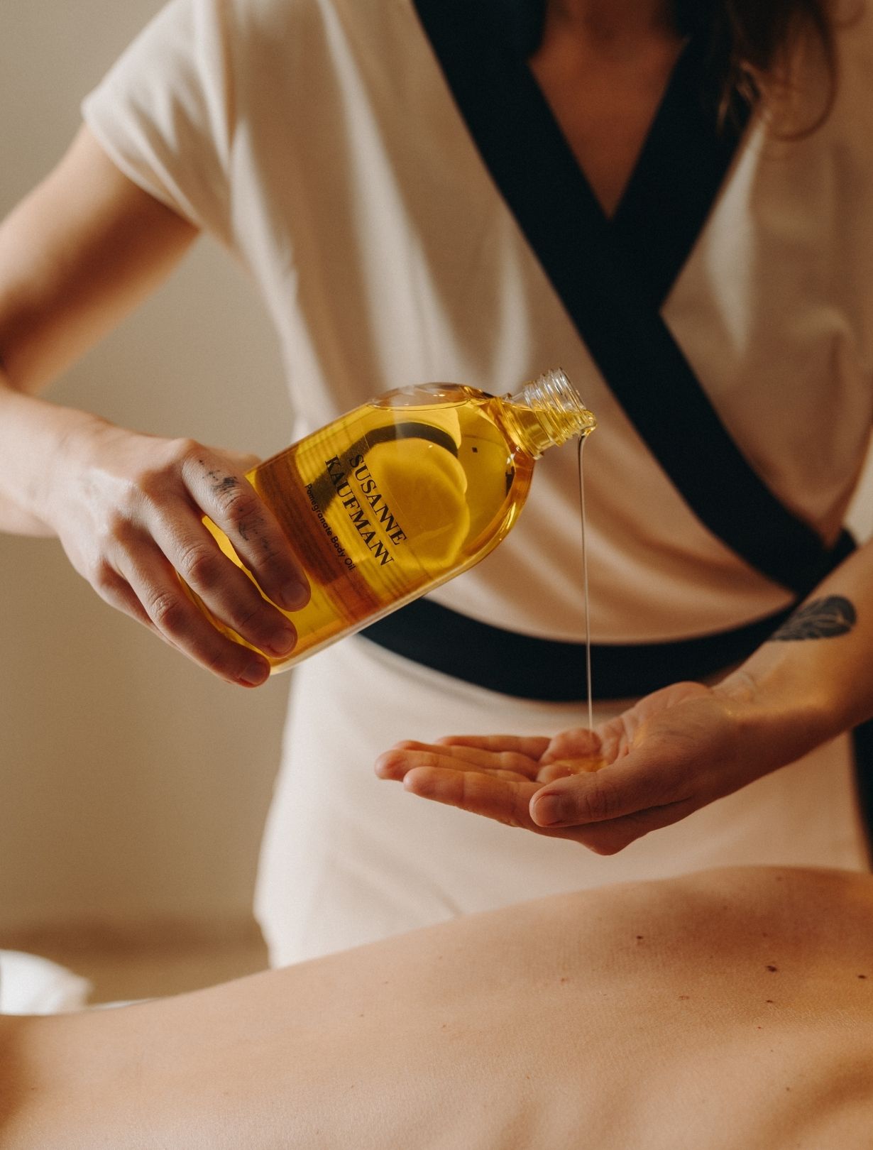 Woman relaxing with a glass of wine in a cozy atmosphere at the Refuge Chez La Tante, Megève.