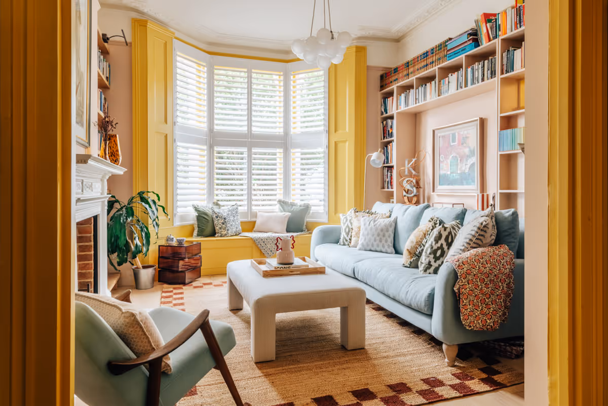 Preview of the Montpellier Grove project. A bright A bright, joyful living room with pastel colours and a bold yellow window frame.