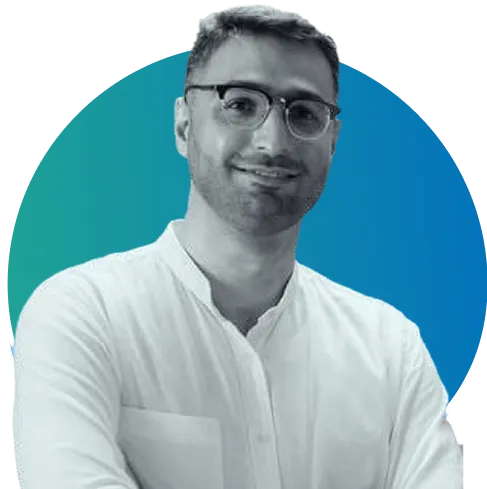 A man wearing glasses and a white shirt.