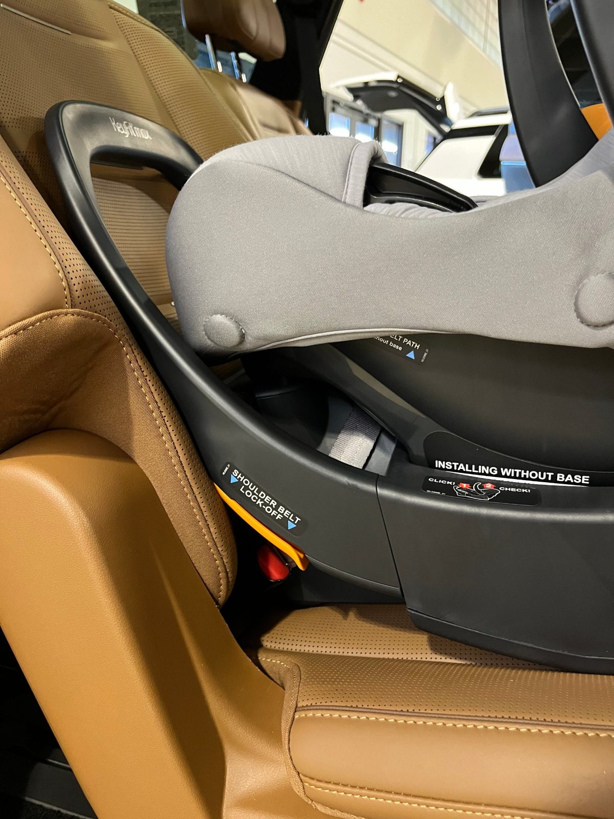 Close-up of the orange shoulder belt lock-off on the Chicco KeyFit Max base