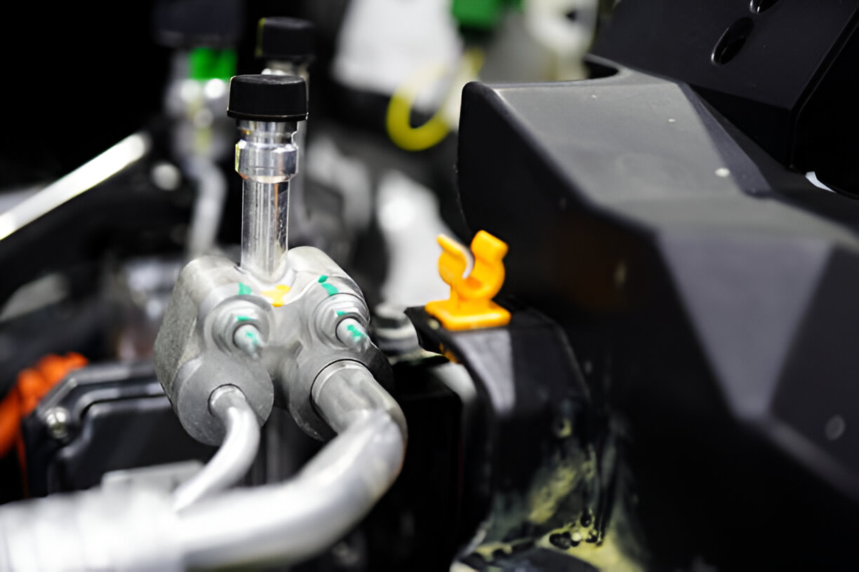 Complex machinery with tubes, connectors, and metallic components in close-up