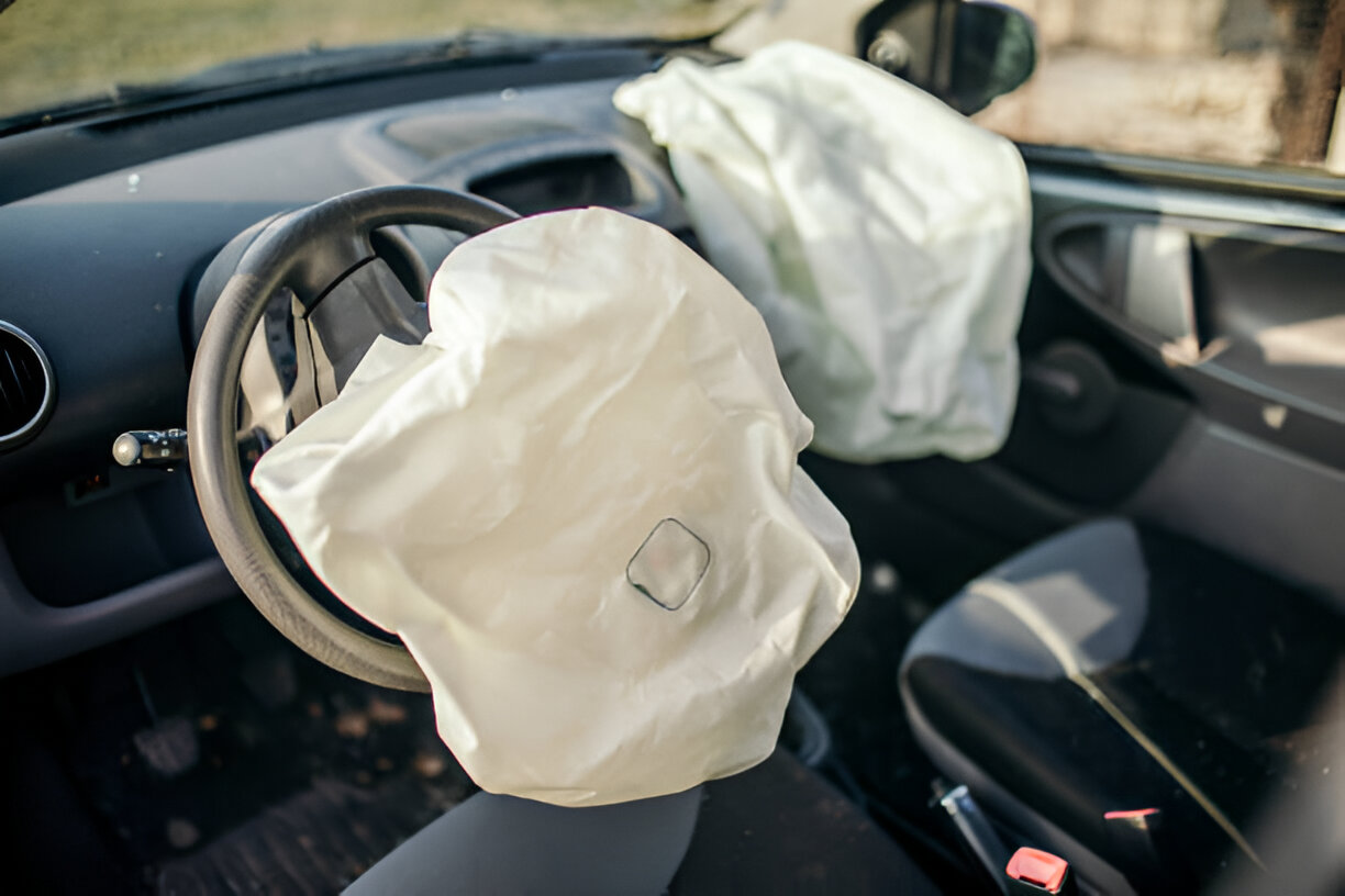 Deployed airbag inside a vehicle after a collision