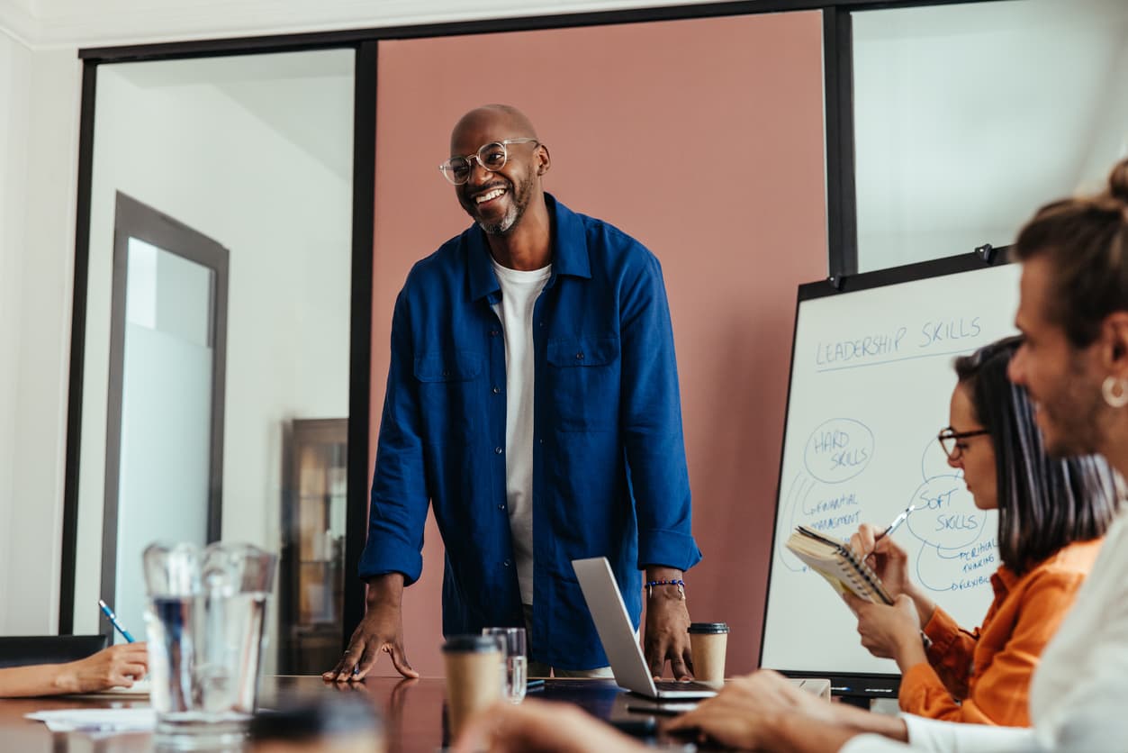 A corporate leader talking with employees.