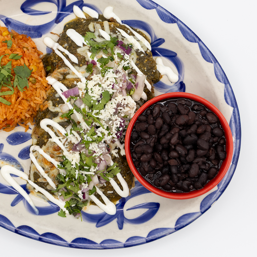 Close up of Mexican food served on a blue and white plate from Taco Diablo in Evanston