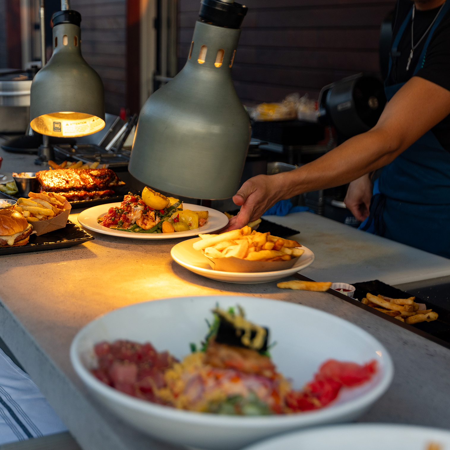 Food being plated and served by the Core and Rind culinary team