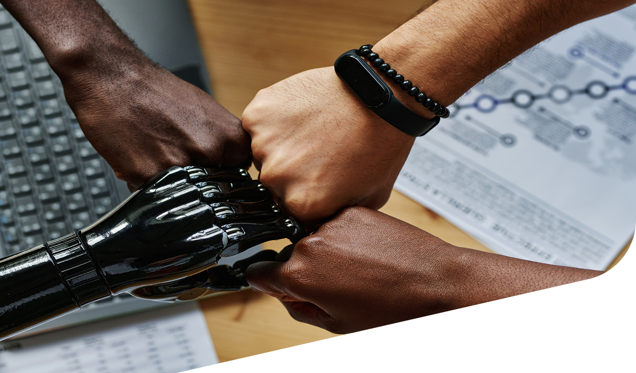 Humans and robot hands together symbolizing a faster and better system.