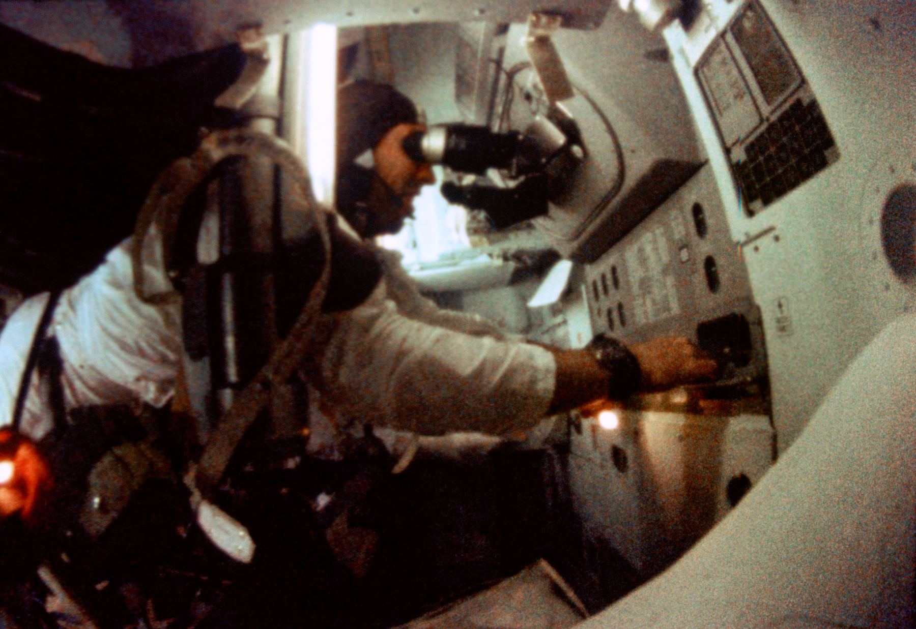 James A. Lovell Jr. at the Apollo 8 guidance and navigation station.