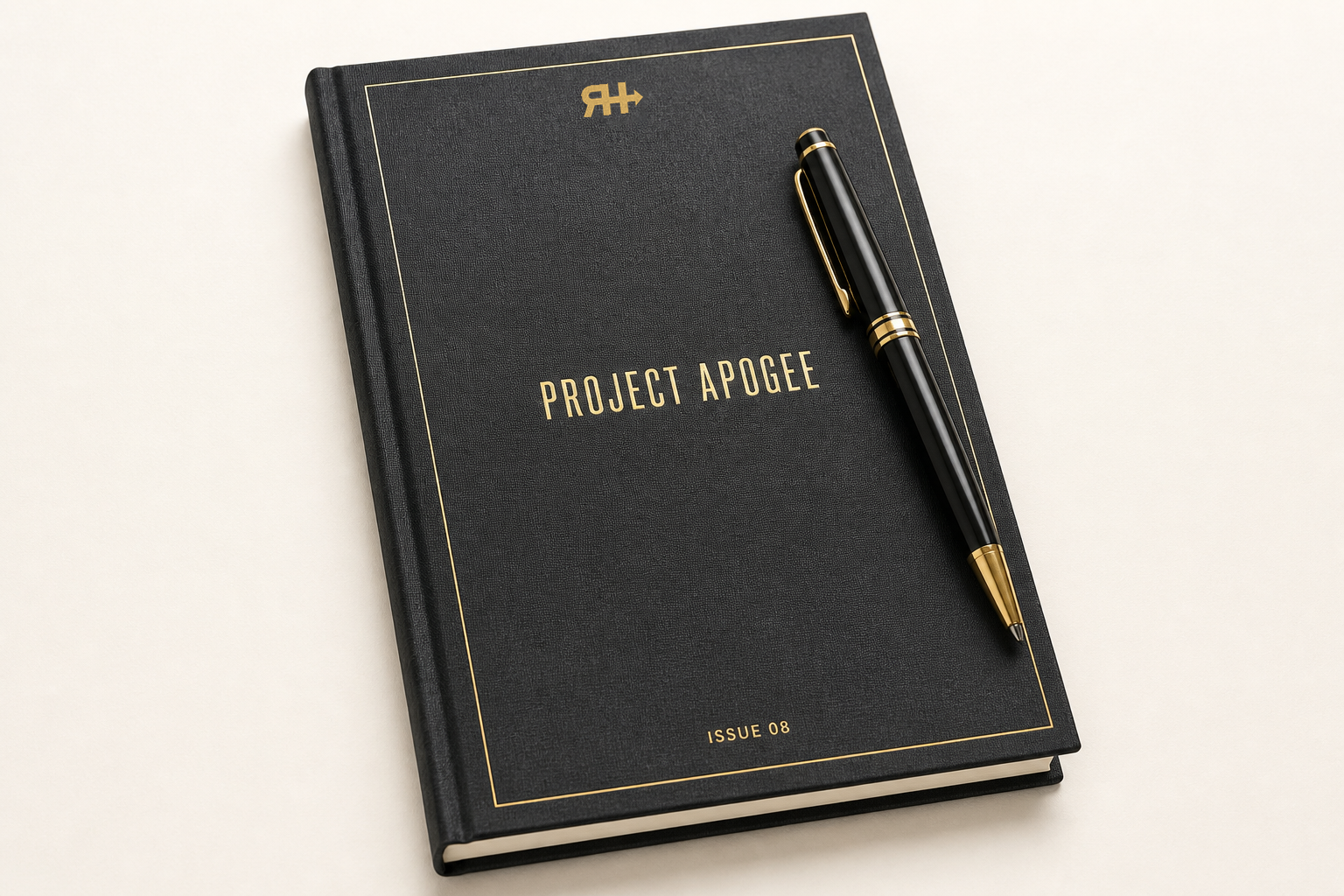 Charcoal field book with gold foil PROJECT APOGEE and official RH mark, gold pen across.