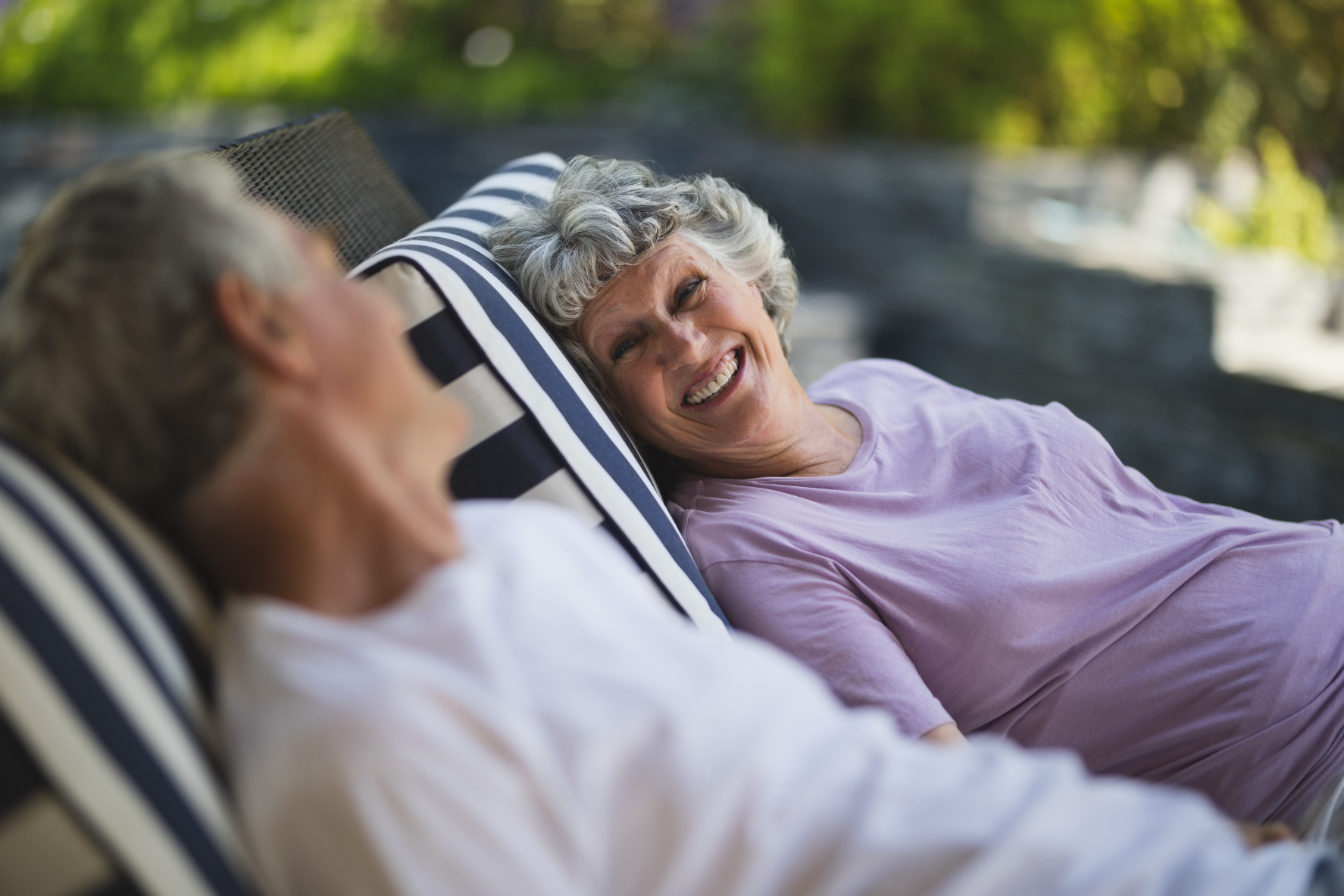 couple on lounge chair stock image