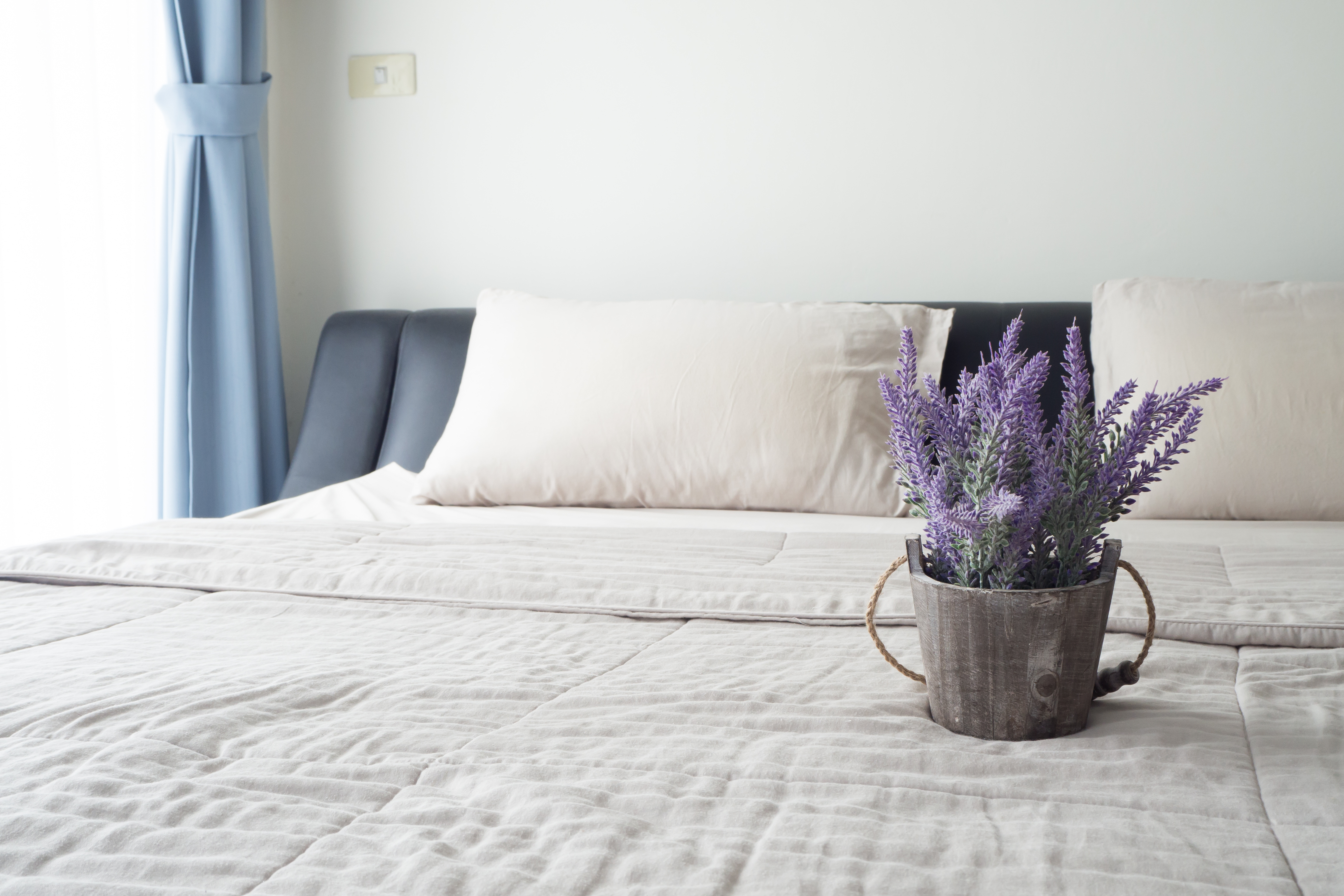 bed with decorative flower vase stock image